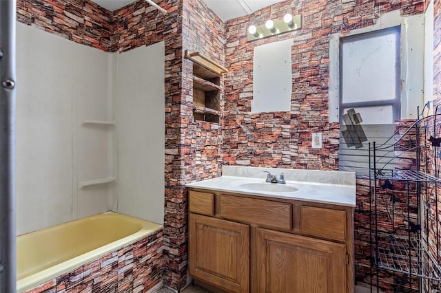 full bathroom featuring vanity and tiled shower / bath