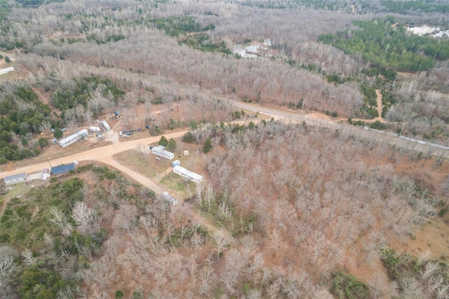aerial view of property's location featuring a heavily wooded area