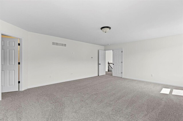 614 Tull Ct, Wentzville, MO 63385 - carpeted empty room with baseboards