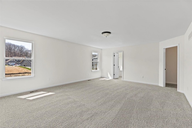 614 Tull Ct, Wentzville, MO 63385 - empty room featuring healthy amount of natural light, carpet flooring, and baseboards