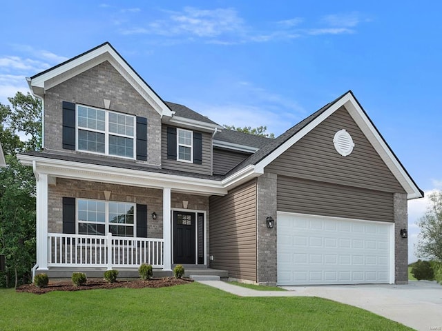 409 Fleming Cir, Wentzville, MO 63385 - view of front of house with covered porch, concrete driveway, a front lawn, and an attached garage