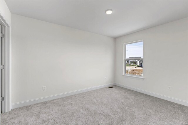 409 Fleming Cir, Wentzville, MO 63385 - carpeted spare room featuring baseboards