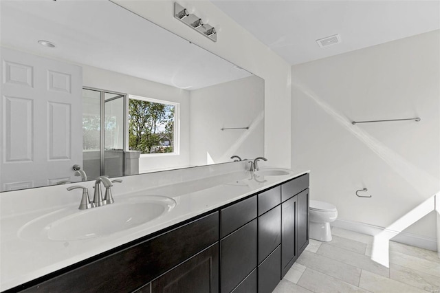409 Fleming Cir, Wentzville, MO 63385 - full bathroom with toilet, double vanity, and a shower with door