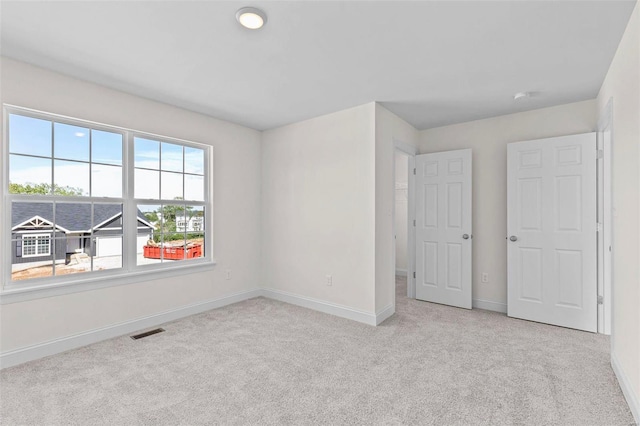 409 Fleming Cir, Wentzville, MO 63385 - carpeted spare room with baseboards
