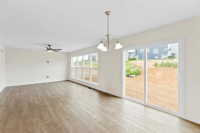 411 Fleming Cir, Wentzville, MO 63385 - unfurnished dining area featuring wood finished floors, a chandelier, ceiling fan, and baseboards