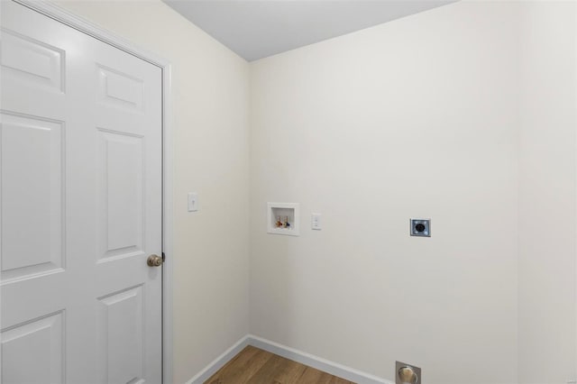 411 Fleming Cir, Wentzville, MO 63385 - clothes washing area featuring hookup for an electric dryer, washer hookup, baseboards, and wood finished floors