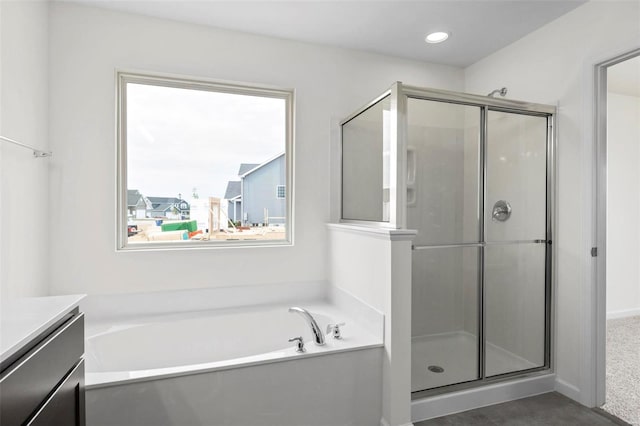 411 Fleming Cir, Wentzville, MO 63385 - full bathroom featuring a shower stall, a bath, vanity, and recessed lighting