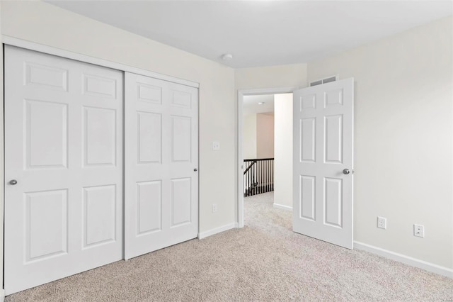 411 Fleming Cir, Wentzville, MO 63385 - unfurnished bedroom with carpet floors, a closet, and baseboards
