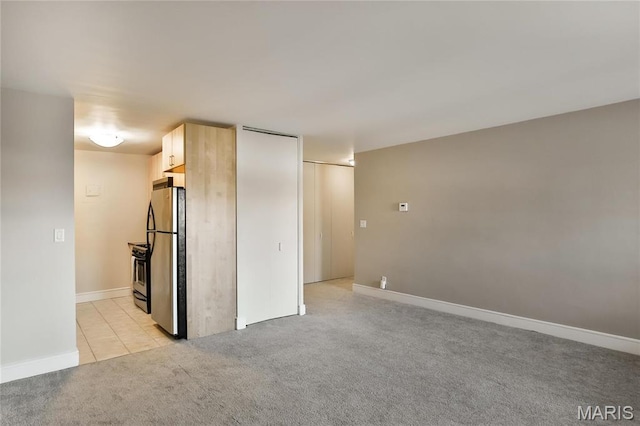 210 N 17th St Unit 411, Saint Louis, MO 63103 - spare room with light carpet and baseboards