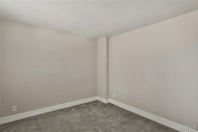 210 N 17th St Unit 411, Saint Louis, MO 63103 - unfurnished room featuring dark colored carpet and baseboards