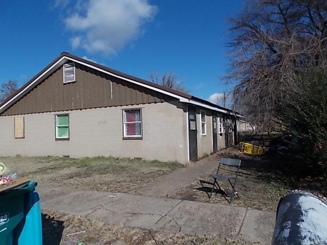 403 E 15th, Caruthersville, MO 63830 - view of property exterior with concrete block siding