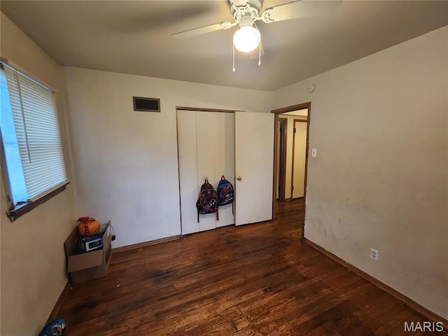 11665 Larimore Rd, Saint Louis, MO 63138 - unfurnished bedroom featuring wood finished floors, a closet, a ceiling fan, and baseboards