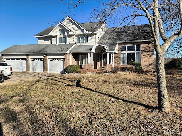 10740 Wilmena Ln, Rolla, MO 65401 - view of front of property featuring brick siding, driveway, a front yard, and a shingled roof