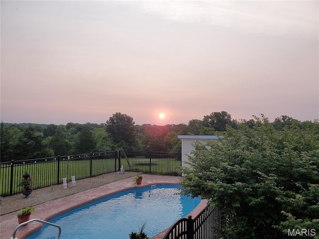 10740 Wilmena Ln, Rolla, MO 65401 - pool at dusk with a fenced backyard