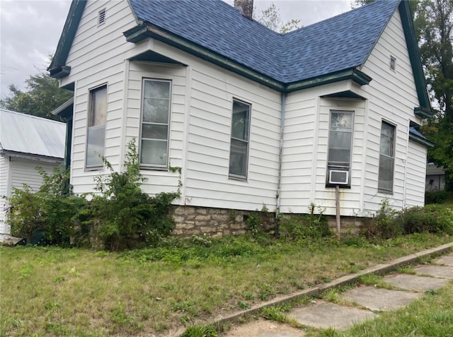view of side of property featuring a chimney