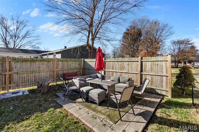 216 Sherrie Dr, Sikeston, MO 63801 - fenced backyard with outdoor lounge area and a patio area