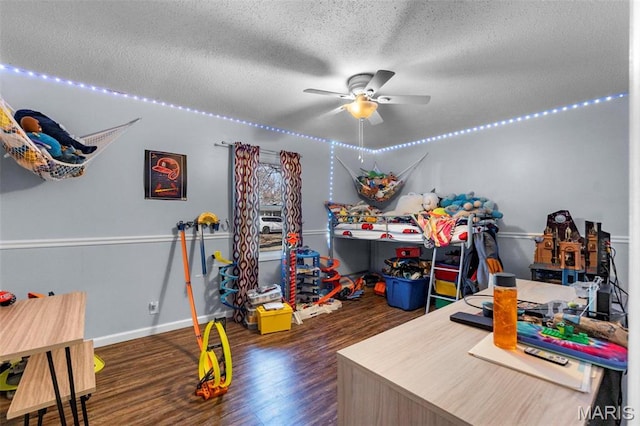 216 Sherrie Dr, Sikeston, MO 63801 - playroom with ceiling fan, wood finished floors, and a textured ceiling