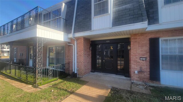 1674 Blue Ridge Dr Unit A, Saint Louis, MO 63125 - entrance to property with covered porch, brick siding, and a balcony