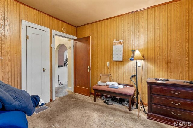 445 Jerome Ln, Cahokia, IL 62206 - bedroom with arched walkways, ornamental molding, wooden walls, and carpet floors