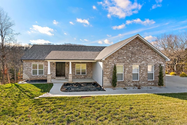 3526 Red Oak Dr, Imperial, MO 63052 - view of front of home featuring brick siding, a front yard, a shingled roof, and a porch