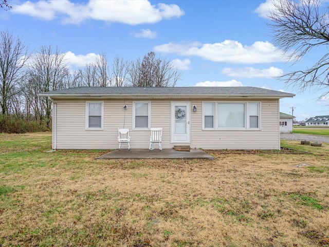 single story home featuring a patio area and a front lawn