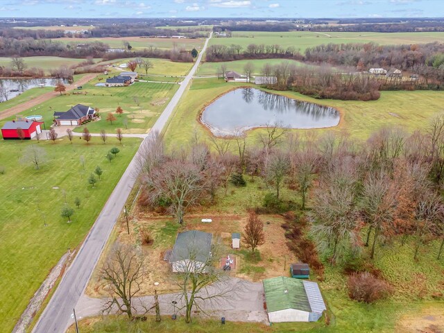 aerial view of property's location with a nearby body of water and rural landscape