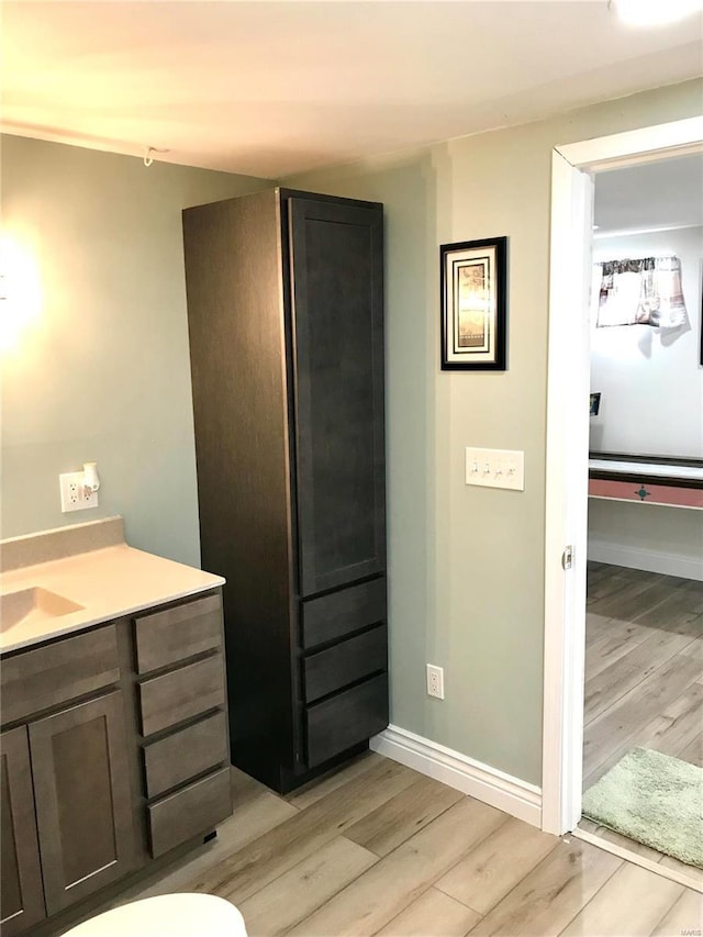 1578 Lakeshore, Cuba, MO 65453 - bathroom with wood finished floors, baseboards, and vanity
