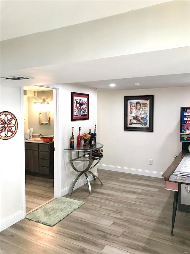 1578 Lakeshore, Cuba, MO 65453 - hallway with light wood-style flooring, baseboards, a sink, and recessed lighting
