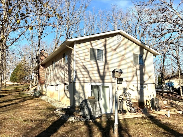 1578 Lakeshore, Cuba, MO 65453 - view of home's exterior featuring a chimney and cooling unit