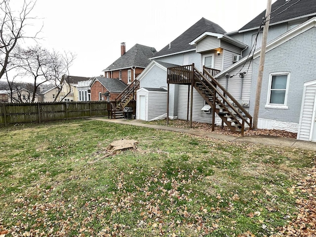 221 N 3rd St Unit 221, Louisiana, MO 63353 - view of yard with stairway, a storage shed, a deck, and an outbuilding