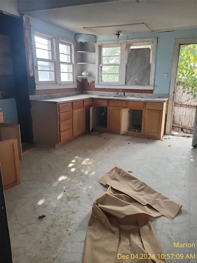 403 E Main St, Marion, IL 62959 - kitchen with brown cabinets, plenty of natural light, and light countertops