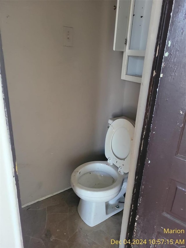 403 E Main St, Marion, IL 62959 - bathroom featuring toilet, tile patterned flooring, and baseboards
