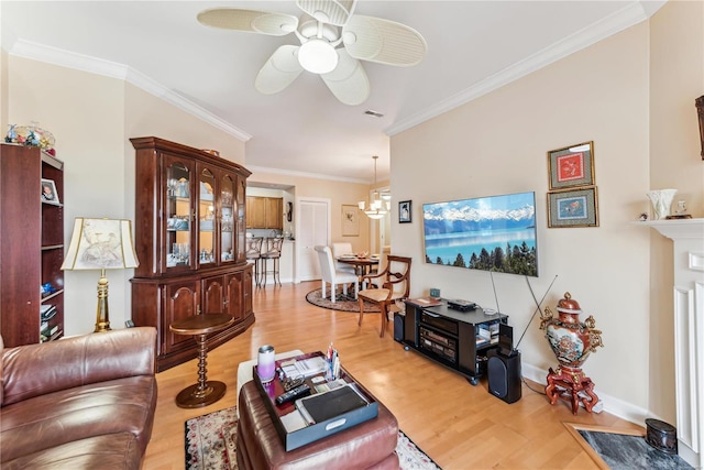 13101 Mill Crossing Ct Unit 307, Creve Coeur, MO 63141 - living room with wood finished floors, crown molding, ceiling fan, baseboards, and a chandelier
