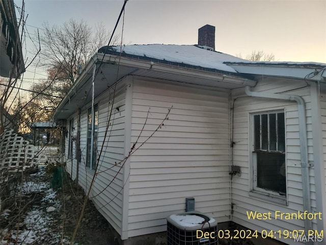 1415 E Oak St, West Frankfort, IL 62896 - view of side of property featuring central air condition unit and a chimney