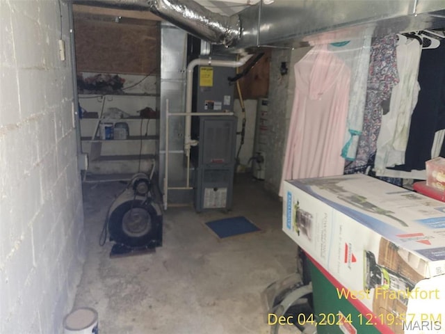 1415 E Oak St, West Frankfort, IL 62896 - unfinished below grade area featuring concrete block wall and heating unit