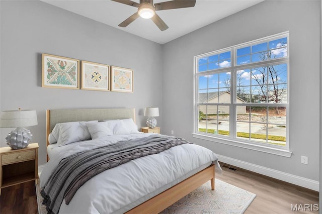201 Keaton Woods Dr, Ofallon, MO 63368 - bedroom with baseboards, wood finished floors, and ceiling fan