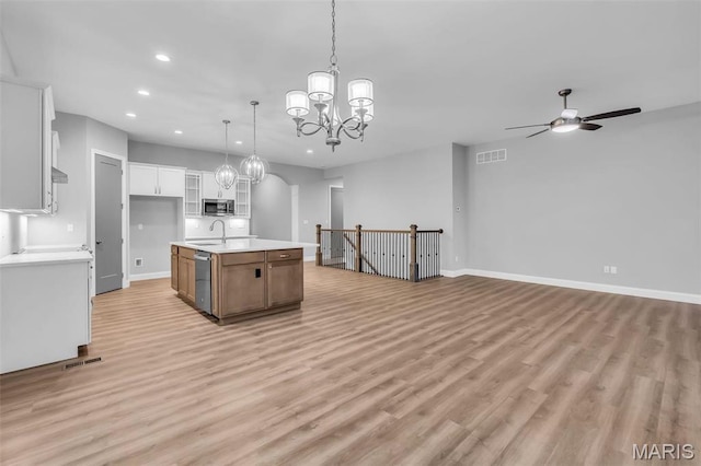 201 Keaton Woods Dr, Ofallon, MO 63368 - kitchen with stainless steel microwave, recessed lighting, ceiling fan, open floor plan, and light wood finished floors