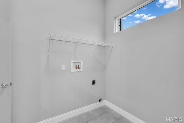 201 Keaton Woods Dr, Ofallon, MO 63368 - laundry area with hookup for an electric dryer, washer hookup, light marble finish floors, and baseboards