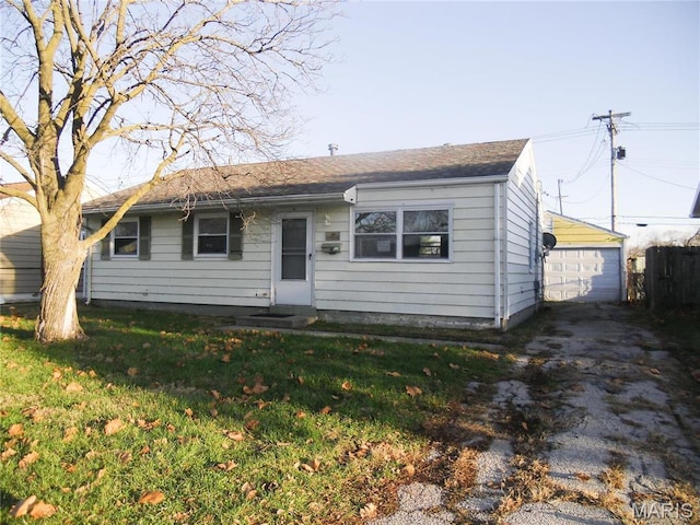 26 Briarcliff Dr, Granite City, IL 62040 - view of front of home with a front lawn, a garage, and an outdoor structure
