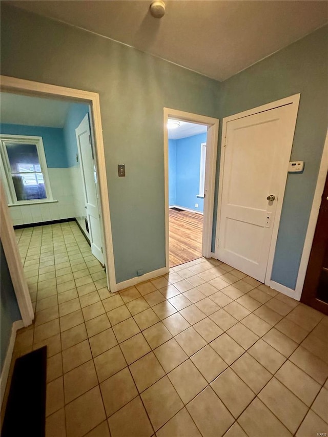 4025 Tholozan Ave, Saint Louis, MO 63116 - unfurnished room with light tile patterned flooring and baseboards
