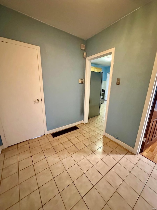 4025 Tholozan Ave, Saint Louis, MO 63116 - spare room with baseboards and light tile patterned floors