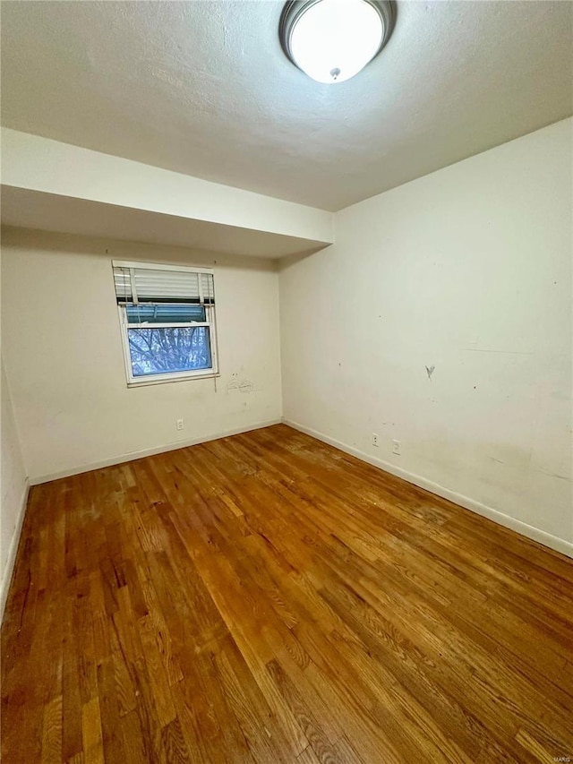 4828 Reavis Barracks Rd, Saint Louis, MO 63123 - empty room with wood finished floors and baseboards