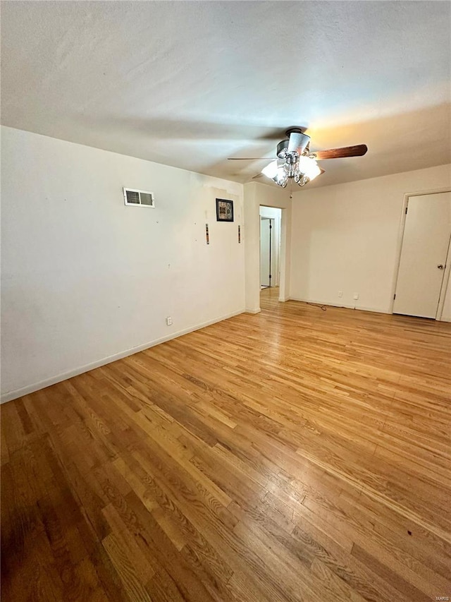 4828 Reavis Barracks Rd, Saint Louis, MO 63123 - empty room with light wood-style floors, ceiling fan, and baseboards
