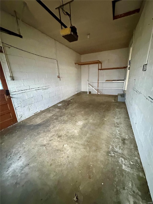 4828 Reavis Barracks Rd, Saint Louis, MO 63123 - garage featuring a garage door opener and concrete block wall