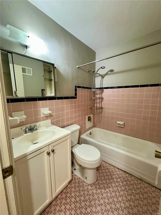 4828 Reavis Barracks Rd, Saint Louis, MO 63123 - full bathroom with  shower combination, toilet, tile walls, and vanity
