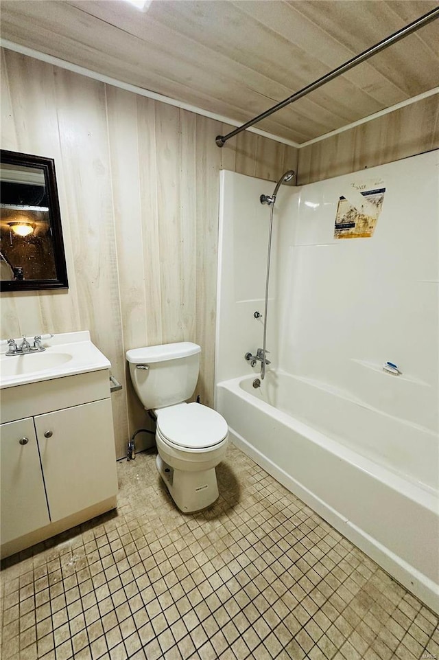 4828 Reavis Barracks Rd, Saint Louis, MO 63123 - bathroom with toilet, vanity, tub / shower combination, wood walls, and tile patterned floors