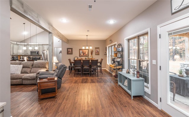 living area with dark wood-style floors, lofted ceiling, baseboards, and recessed lighting