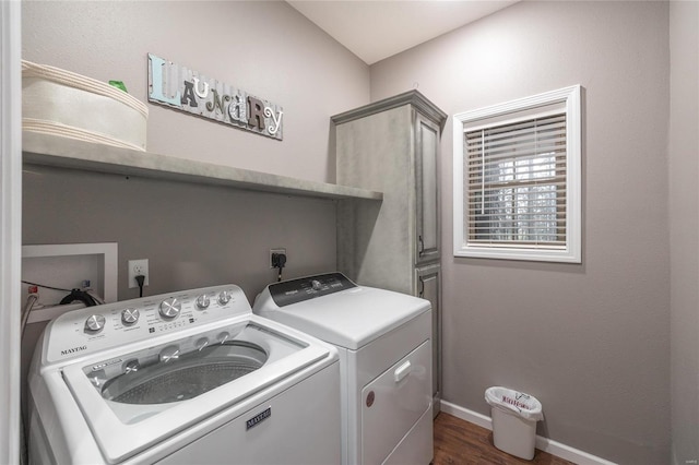 washroom featuring washer and dryer, dark wood-style floors, and baseboards