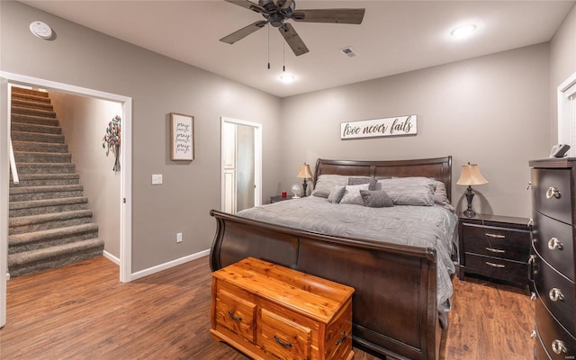bedroom featuring wood finished floors, baseboards, a ceiling fan, and recessed lighting