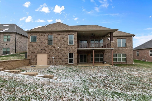 1661 Helmsdale Cpe, Girardeau, MO 63701 - back of house with a balcony, brick siding, a patio, a ceiling fan, and roof with shingles